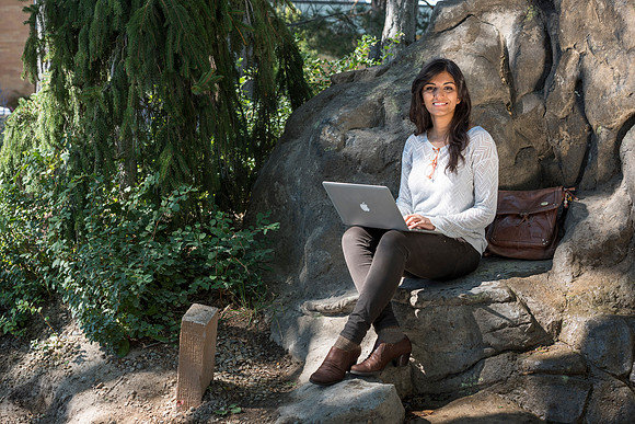 Student Noor Sofi poses in the Gardens for online learning.