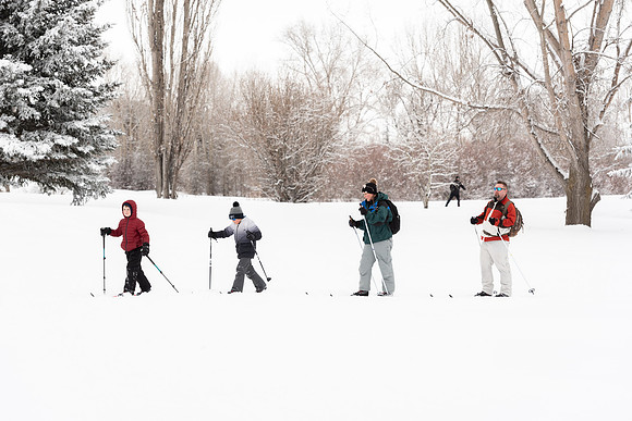 Volunteers and Community members enjoying Winter Fest at the Teton Lakes Golf Course.