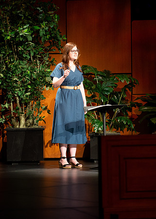 BYU-I student conducting a hymn during devotional.