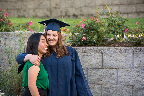 Faculty, family and graduates around campus after the commencement ceremony. Photo by Ryan Chase