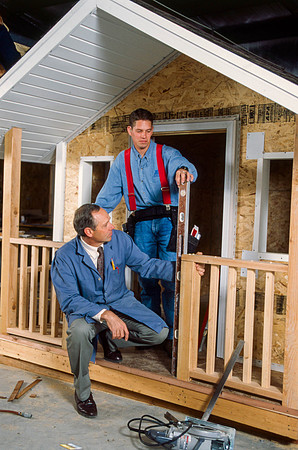 Students work with teacher, Rudy Puzey, to create a play house for Construction Management. Sep 1997.