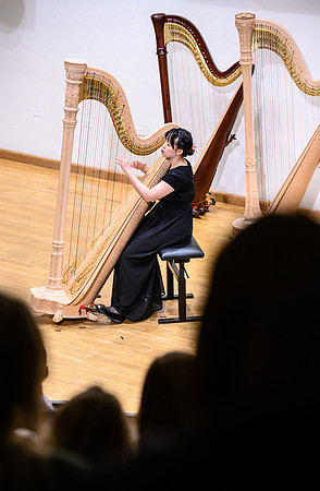 The harp ensemble performs in the recital hall in the Snow building.