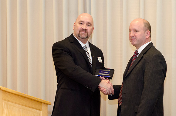Todd Smith receiving an award on behalf of BYU-Idaho from the Office of the Secretary of Defense for the support BYU-Idaho has given to Peter Stilling while he has been serving in the Guard. Awarded b