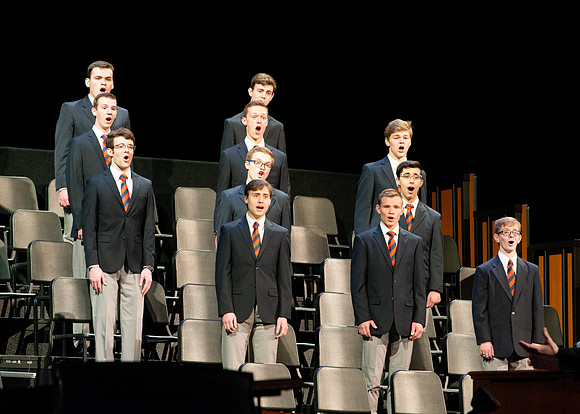 Men choir performing for devotional.