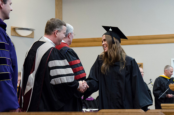 Student Graduates at the College of Education and Human Development Convocation in the HInckley Chapel.