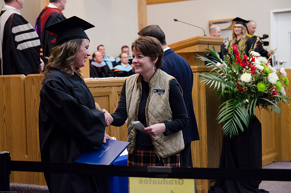 Student Graduates at the College of Education and Human Development Convocation in the HInckley Chapel.