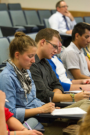 Students take notes as Brother Hyrum Lewis teaches American Foundations during the 2014 Spring Semester.