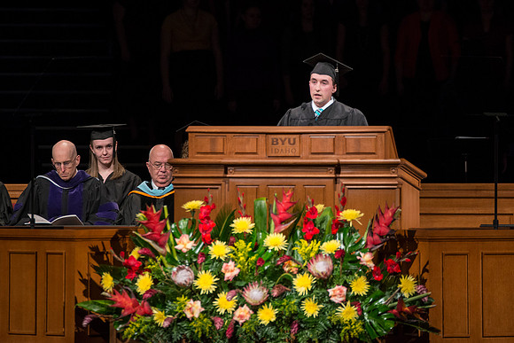 April 2014 Graduation ceremonies in the BYU-Idaho Center. Johnathan Weber, a Financial Economics graduate gives the scripture reading.