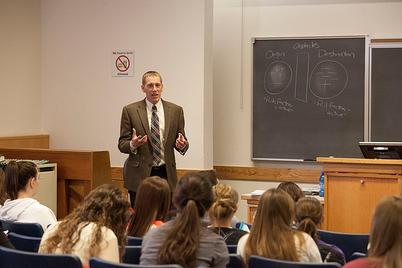 Brother Michael Madsen teaches his early morning Geography For Elementary Teachers class in the Ricks Building.