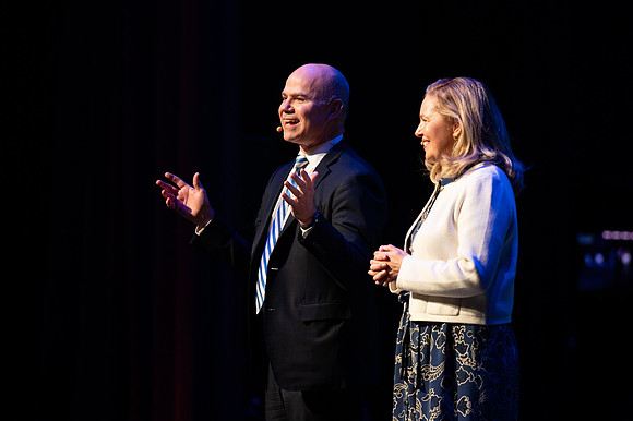 President and Sister Meredith welcome students during New Student Orientation in the Hart Gym.