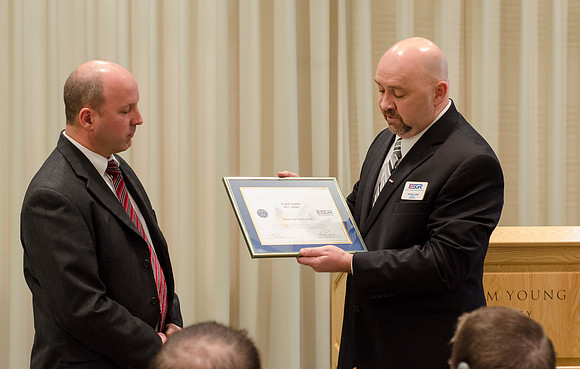 Todd Smith receiving an award on behalf of BYU-Idaho from the Office of the Secretary of Defense for the support BYU-Idaho has given to Peter Stilling while he has been serving in the Guard. Awarded b