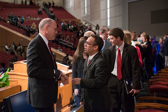 Russel T. Osguthorpe, the president of the the General sunday School, greets students and employees after devotional.