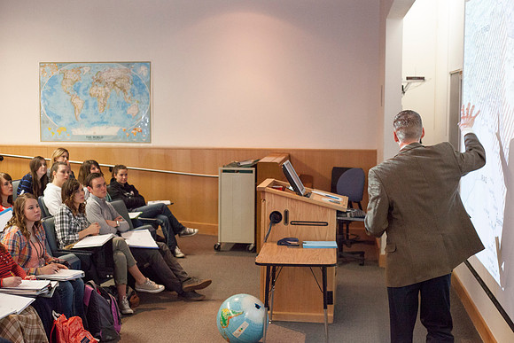 Brother Michael Madsen teaches his early morning Geography For Elementary Teachers class in the Ricks Building.