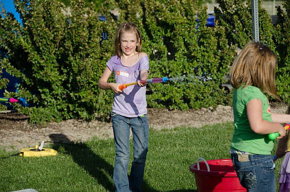 Online instructors gather with their families for an eveing of BBQ and games.
