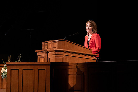 Amanda Kingsford speaks in devotional to an empty auditorium due to Covid-19 restrictions.