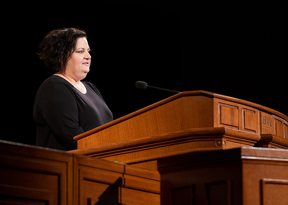 Sister Jacquel Fluckiger giving a talk during devotional.