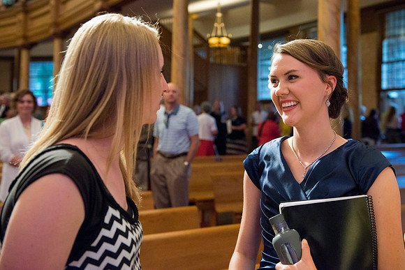 Friends congratulate a student after the Sacred Music concert. Photo by Ryan Chase