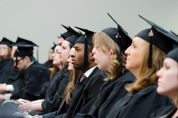 Student Graduates at the College of Education and Human Development Convocation in the HInckley Chapel.