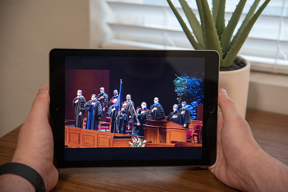 A BYU-Idaho Student watching the Spring Graduation Live Stream