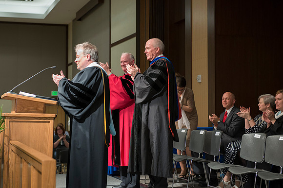 Jon Ivers, President Clark and Elder Maynes congratulate the graduates. College of Language and Letters Convocation in the Manwaring Center Ballroom.