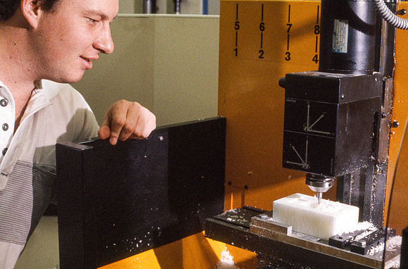 Student works alongside teacher in Manufacturing Technology. January 1990.