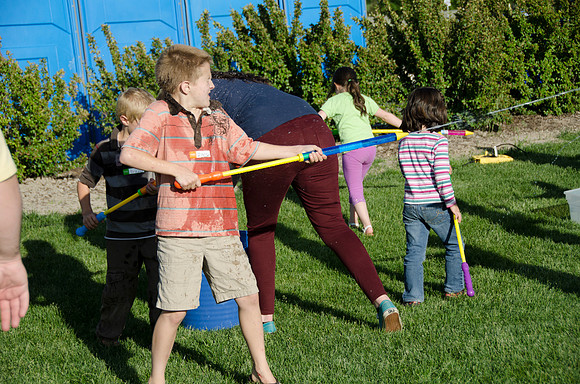 Online instructors gather with their families for an eveing of BBQ and games.