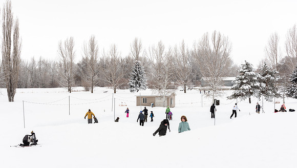 Volunteers and Community members enjoying Winter Fest at the Teton Lakes Golf Course.