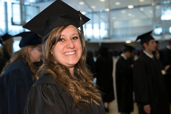 Graduates gather and march in during the processional for April 2014 Graduation ceremonies in the BYU-Idaho Center.