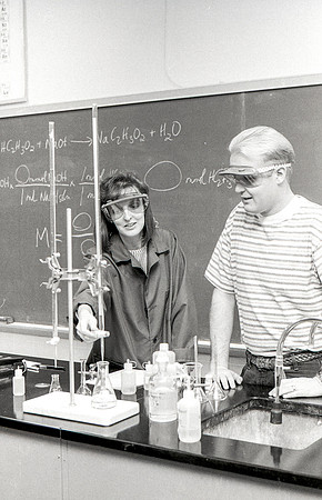 Chemistry teacher, Susan Ward, works with students during their Chemistry lab. December 1995.