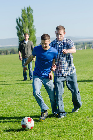 A group of students play a friendly game of soccer.