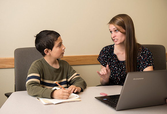 Teacher Education students offer their services tutoring kids 3rd grade to 12th grade. Hannah Paget tutoring Jaden Davis.