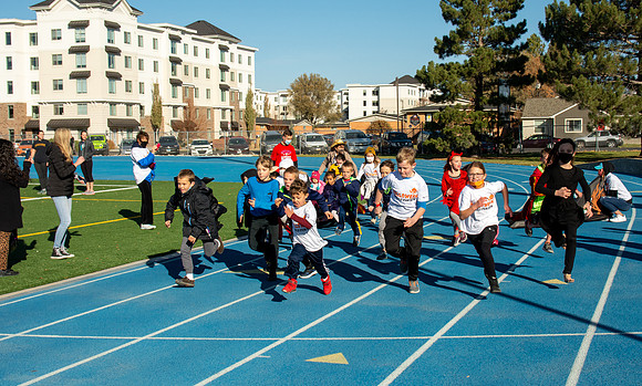 BYU-Idaho employees and their families enjoy a beautiful fall day at the stadium track.