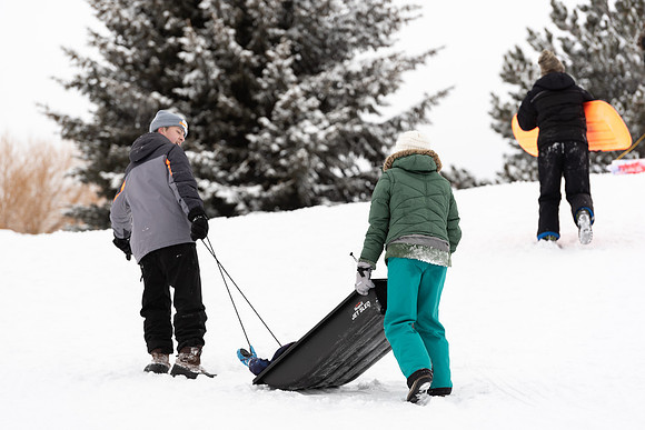 Volunteers and Community members enjoying Winter Fest at the Teton Lakes Golf Course.