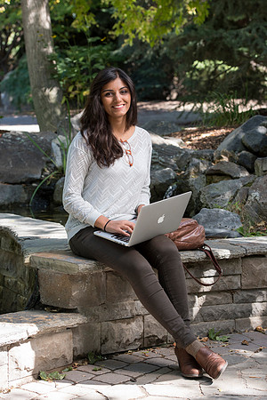 Student Noor Sofi poses in the Gardens for online learning.
