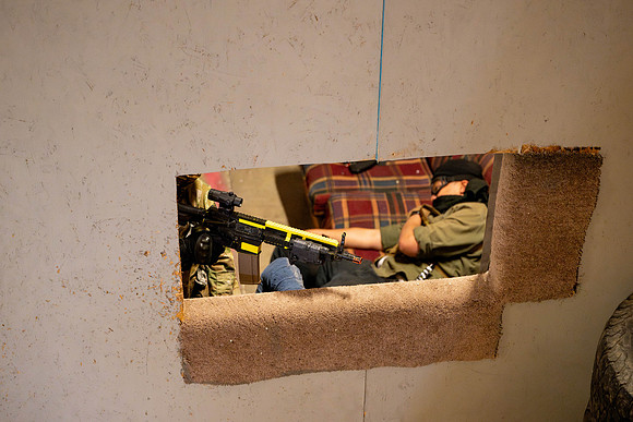 ROTC practices military tatics in an Advantage Airsoft facility.