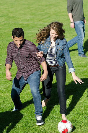 A group of students play a friendly game of soccer.