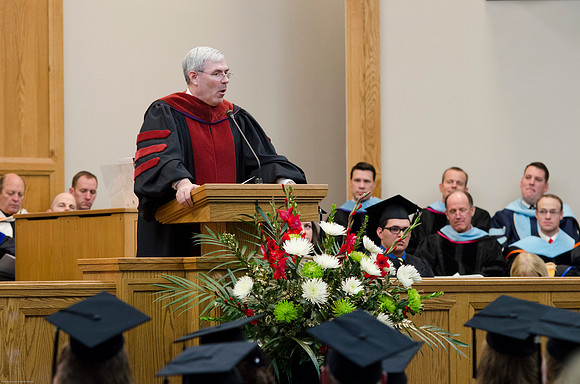 Edwin A. Sexton, Associate Academic Vice Presdient for Curriculum, speaks to students at the College of Education and Human Development Convocation.