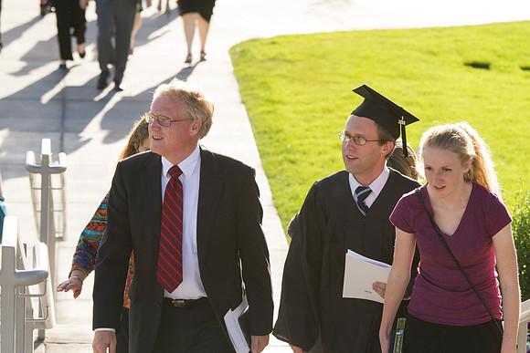 Graduates meet outside on the BYU-Idaho campus after commencement to take pictures before convocation starts.