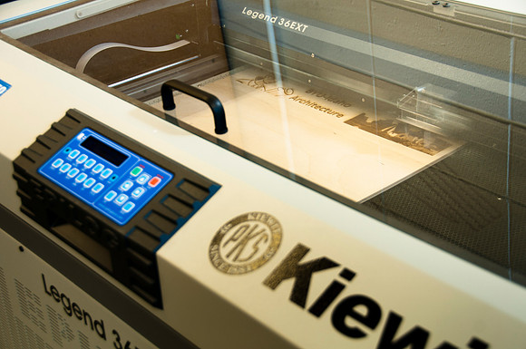 Ron Kinville operates the new Kiewit lazer cutter that was donated to the Architecture and Construction Dept.